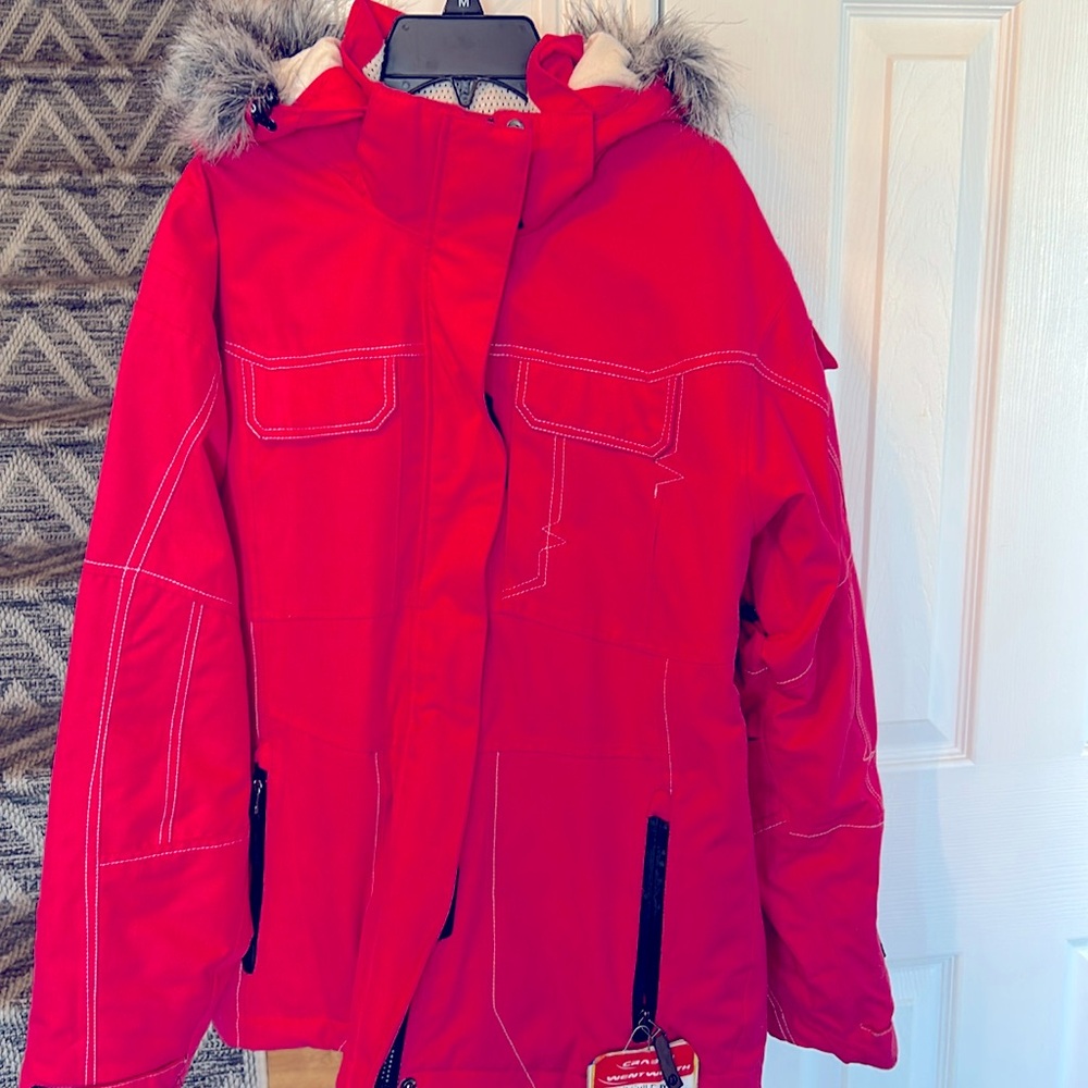 Ski/ snowboard jacket is Barbie pink